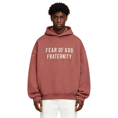 Fear of God Essentials Heavy Fleece Hoodie Crimson worn by model from the front