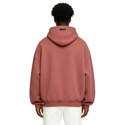 Fear of God Essentials Heavy Fleece Hoodie Crimson shown on model from the back