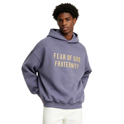 Fear of God Essentials Heavy Fleece Hoodie Lavender worn by model from the front