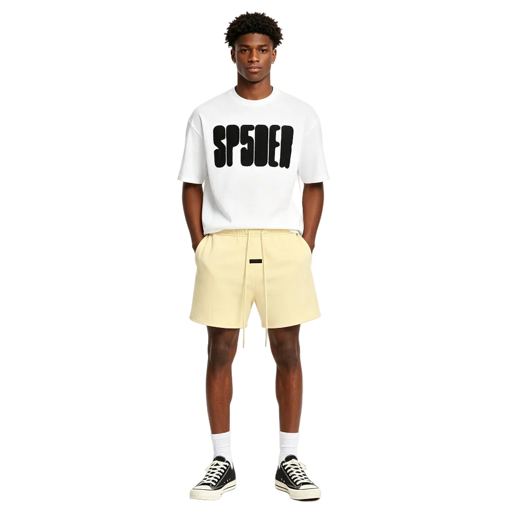 Fear of God Essentials Sweatshort Garden Yellow worn by model from the front