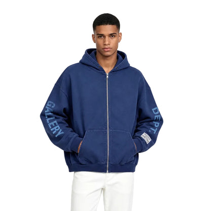 Model wearing Gallery Dept. 90s Logo Zip Up Hoodie in Navy – front view highlighting the signature chest logo and zip-up closure