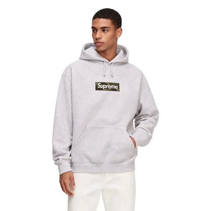 Model wearing Supreme Box Logo Hooded Sweatshirt FW23 Ash Grey – front view highlighting the camo chest logo and drawstring hood