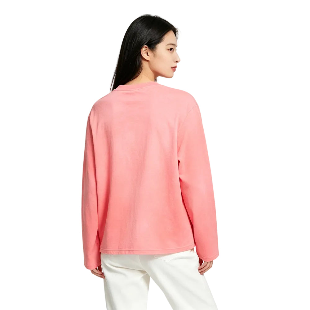 Acne Studios Sprayed 1996 Logo T Shirt Tango Pink worn by model – back view displaying the faded pink texture and loose long-sleeve shape