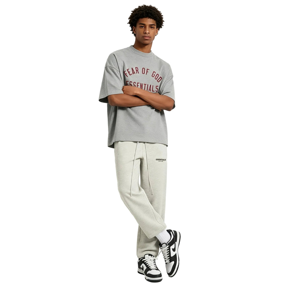 Fear of God Essentials Core Collection Relaxed Sweatpants Light Oatmeal worn by model from the front