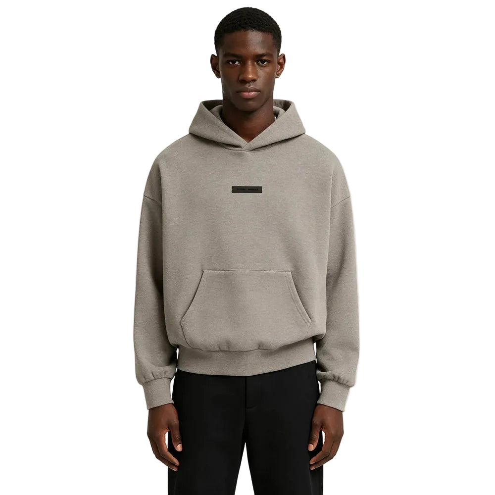 Fear of God Essentials Classic Fit Fleece Hoodie Homestead Heather worn by model from the front